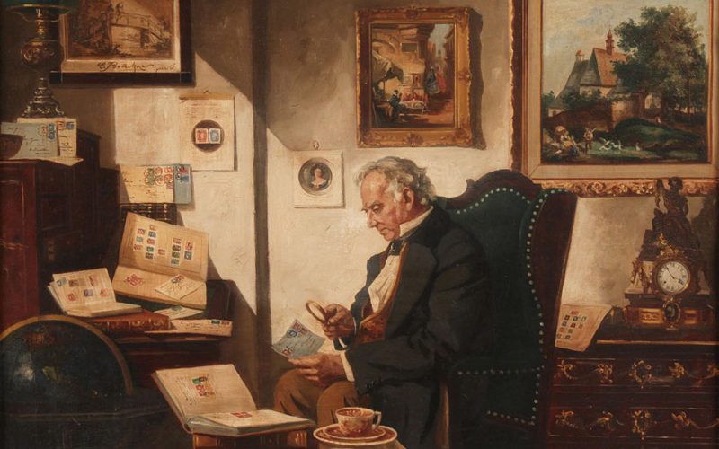 Framed oil on canvas painting, genre (interior) scene of man studying stamps with a magnifying glass, amongst opened stamp albums.
